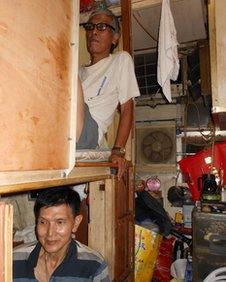 Mr Wong (above) and Mr Lee live in bunk bed accommodation called "coffin homes"
