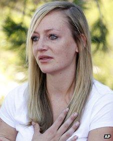 Amanda Lindgren cries as she speaks about boyfriend Alex Teves at the court in Centennial, Colorado on 23 July 2012