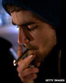 A man smokes marijuana in Seattle shortly after a law legalising its recreational took effect in Washington state on 6 December 2012