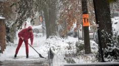 A resident shovels snow in Chicago, Illinois on 11 November, 2019