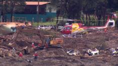Helicopter hovers over mud slide