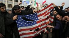 Iranians burn a US flag after Friday prayers in Tehran, Iran, 3 January 2020