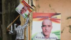 Activists in India with signs reading 'India with Kulbhushan' and 'Justice for Kulbhushan'