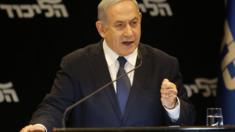 Israeli Prime Minister Benjamin Netanyahu speaks at a press conference regarding his intention to file a request to the Knesset for immunity from prosecution, in Jerusalem on January 1, 2020