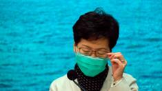 Carrie Lam wears a face mask at a press conference