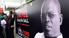 This file photo taken on July 31, 2017 shows a banner with a picture of Dakar's mayor Khalifa Sall, in jail awaiting trial for what supporters say are politically motivated embezzlement charges, on display in front of his offices in Dakar.