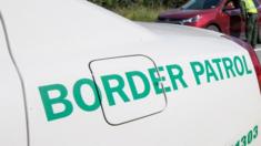 Generic border control logo on a car at checkpoint