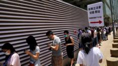Voters queue in Hong Kong on Sunday