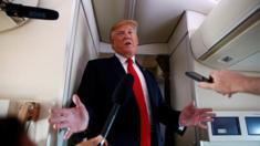 President Donald Trump speaks to the press on board Air Force One en route to New Jersey, June 29, 2018