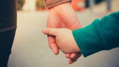 A generic image of an adult holding a child's hand