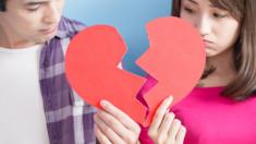 Couple pose with broke heart sign