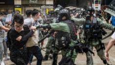 Police pepper spray protesters in Hong Kong