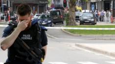 A Belgian police officer at the scene of a shooting in Liege