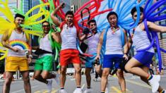 Participants jump in a pose while taking part in the annual gay pride parade in Taipei