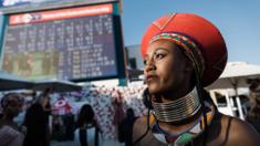 A women looks up at the clock during the 2018 edition of the Vodacom Durban July horse race in Durban, on July 7, 2018