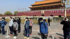 People wearing face masks in Tiananman Square, Beijing, 4 April 2020
