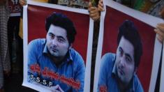 Pakistani protesters with banners demanding justice for Mashal Khan