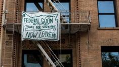 Banner reading: "Federal goon squad: Thanks for visiting. Now leave!"