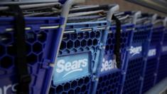 The Sears logo is displayed on shopping carts outside of a Sears store on May 31, 2018 in Richmond, California.
