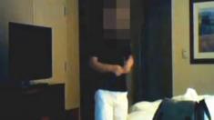 The US Department of Justice has released footage of an alleged Chinese spy carrying out a "dead drop" at a hotel room