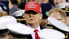 Donald Trump stands with the Navy side of the field to start the second half of the game between the Army Black Knights and the Navy Midshipmen at Lincoln Financial Field on December 14, 2019 in Philadelphia