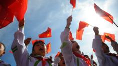 Children waving Chinese flags