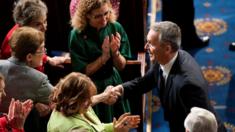Jens Stoltenberg shakes hands with lawmakers before delivering an address to a joint meeting of the US Congress, 3 April