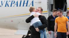 Freed Ukrainian prisoner embraces his relative upon arrival in Kiev after Russia-Ukraine prisoner swap, at Borispil International Airport, outside Kiev.