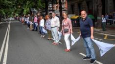 Basque Nationalist Party (PNV)'s senior officials take part in a human chain to demand the right to decide on Basque independence in Bilbao on 10 June 2018