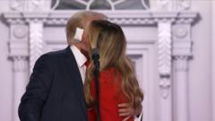 Watch Trump and Melania kiss as balloons drop