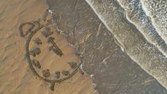 Praia com relógio desenhado na areia