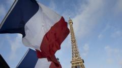 French flags fly at half mast