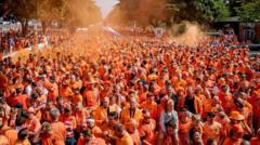 Lions, cheese hats and a double-decker bus – joining the Dutch fan parade