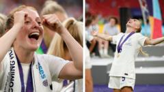 Keira Walsh and Alex Greenwood celebrating England's Euro 2022 win.