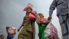Women carry bags of food in Bangladesh