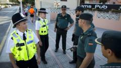 British police officers speaking to their Spanish colleagues