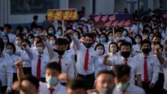 North Korean students take part in a rally denouncing "defectors from the North" as they march from the Pyongyang Youth Park Open-Air Theatre to Kim Il Sung Square in Pyongyang on June 8, 2020
