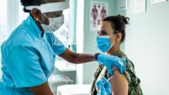 Nurse giving covid vaccine
