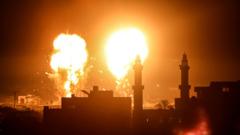 Flames are seen after Israeli air strikes on Gaza City on 16 June 2021
