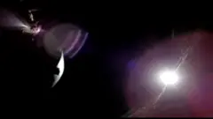 A solar eclipse seen from the dark side of the moon