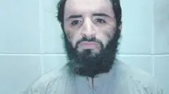 Abu Faraj al-Libi is pictured looking at the camera in a police mugshot following his capture in 2005