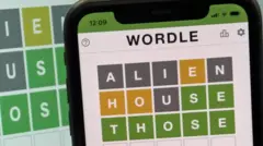This images shows the screen of an IPhone, showing the screen of the online game, Wordle.