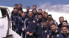 Scotland squad serenaded by piper as they leave for Germany