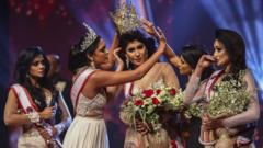 winner of Mrs. Sri Lanka 2020 Caroline Jurie removes the crown of 2021 winner Pushpika de Silva