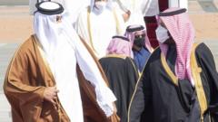 Qatar's Emir Sheikh Tamim bin Hamad Al Thani is greeted by Saudi Crown Prince Mohammed bin Salman on arrival in al-Ula, Saudi Arabia (5 January 2021)