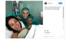Christiano, Georgina and Ronaldo's eldest son, Christiano Jr in a hospital room.