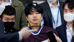 Cho Ju-bin outside the police station, wearing a neck brace
