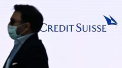 Man in front of Credit Suisse sign