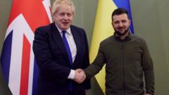 UK Prime Minister Boris Johnson shakes hands with Ukrainian President Volodymyr Zelensky in Kyiv