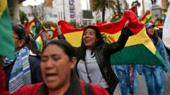 People celebrate after Bolivia's president, Evo Morales, announced his resignation in La Paz,